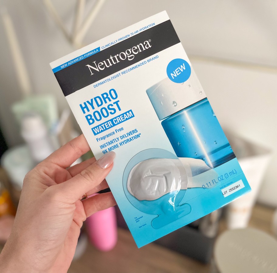 Woman holding a package of Neutrogena Hydro boost, water cream