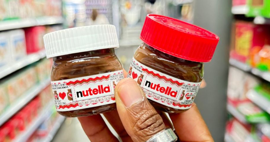 hand holding Nutella Mini Jars in store