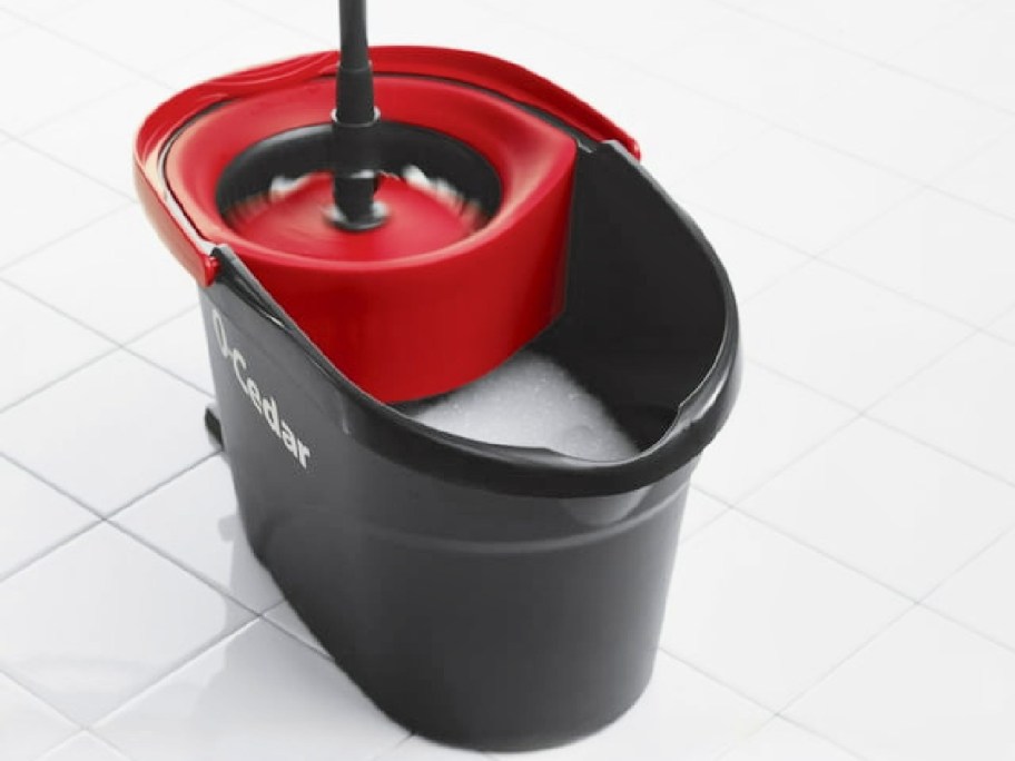 O-Cedar EasyWring Microfiber Spin Mop and bucket on white tile floor
