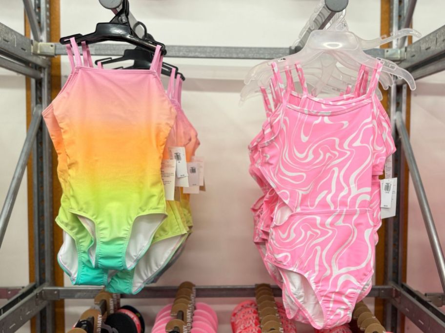 Girls Swimsuits hanging up on racks at Old Navy