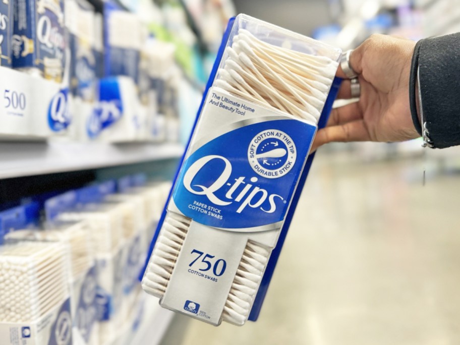 hand holding up a 750-count pack of q-tips in store