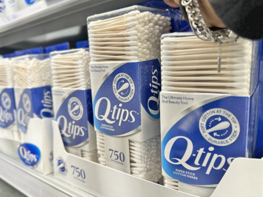 hand grabbing a 750-count box of q-tips from store display