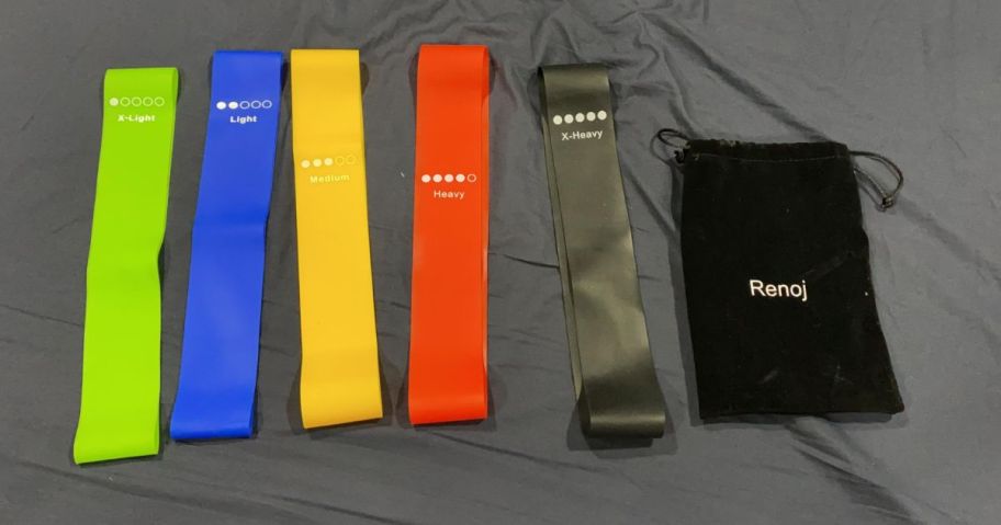 5 Renoj Resistance Bands and Bag on a bed