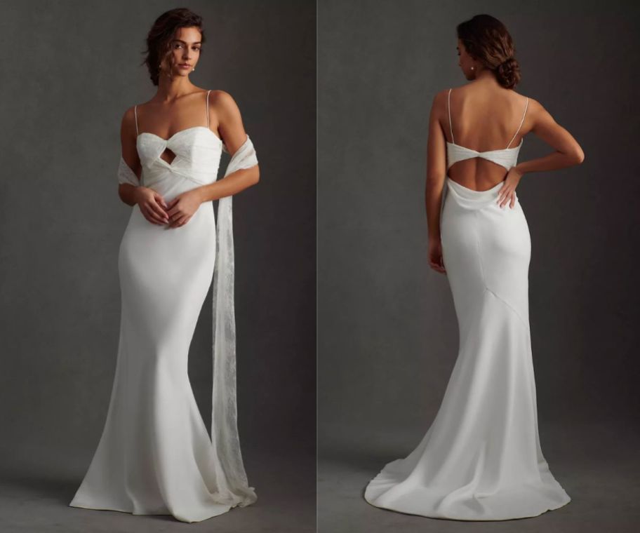a woman wearing a long white mermaid gown with a sweetheart neckline