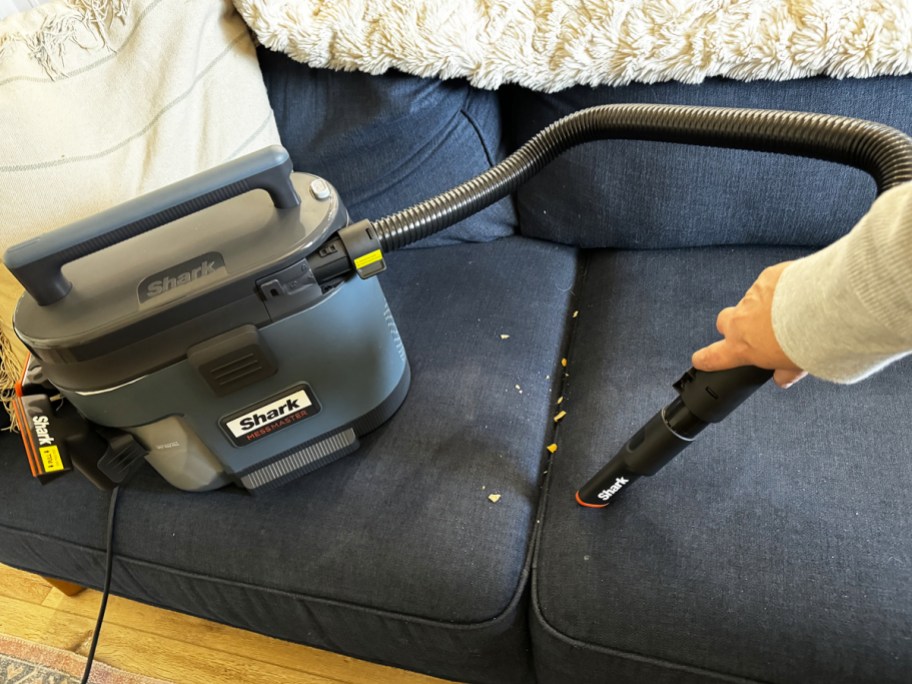 using Shark Messmaster hose attachment on blue couch