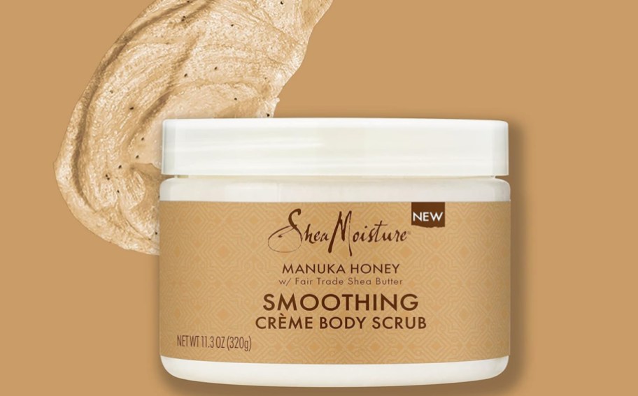 SheaMoisture Smoothing Body Scrub with a scoop of the scrub on the back ground