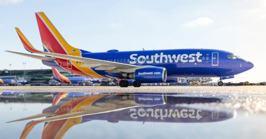 Southwest Airlines plane with reflection in puddle