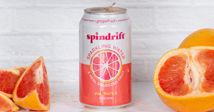 can of grapefruit flavor Spindrift near cut grapefruits