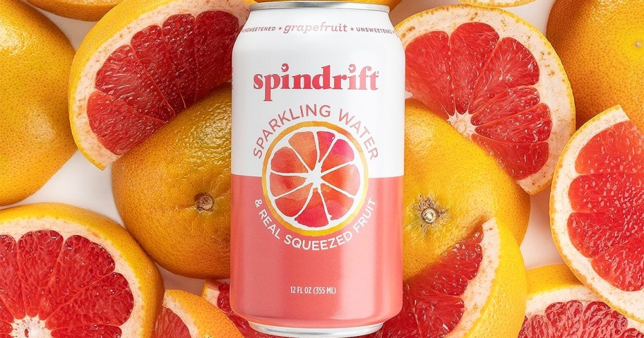 can of grapefruit Spindrift Sparkling Water in a pile of cut grapefruits