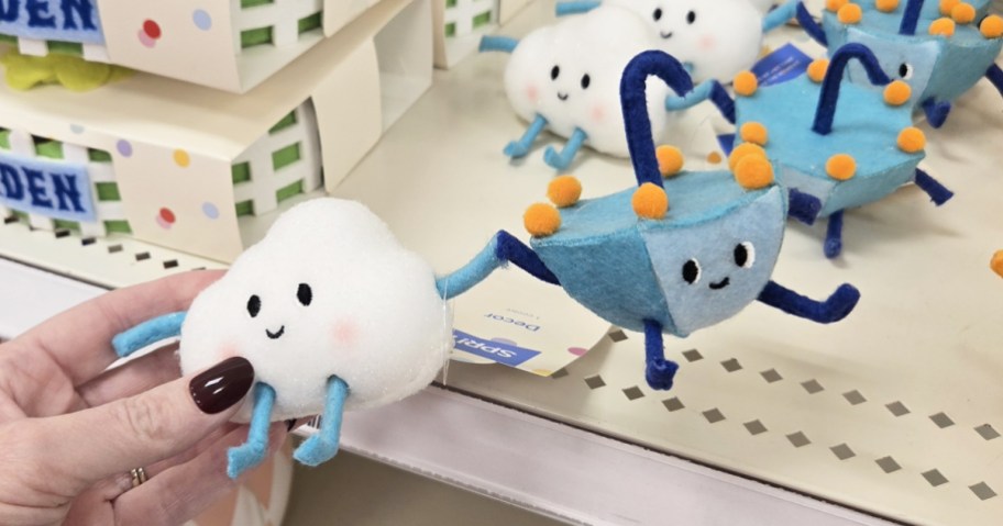 hand holding up a cloud and umbrella felt figurine