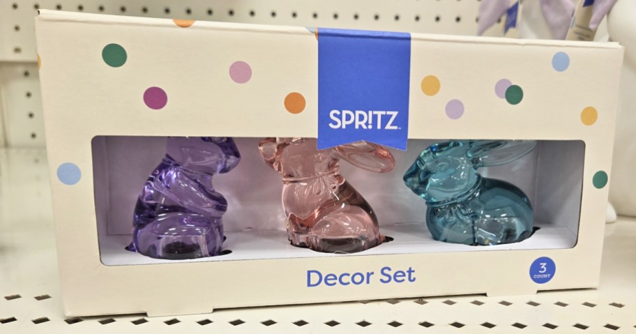 boxes purple, pink, and blue bunny figures on store shelf