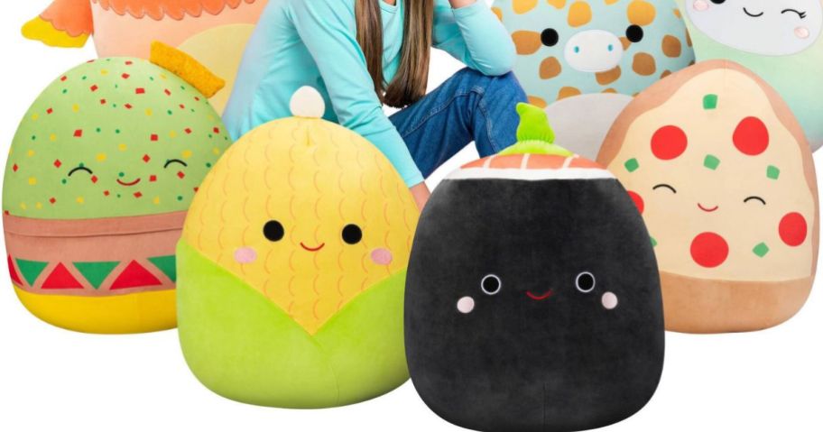 A girl surrounded by Squishmallows Food characters 16 Inch 