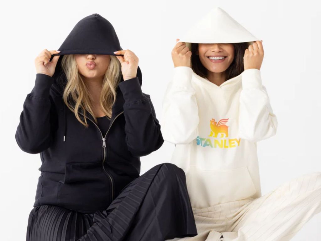 2 women wearing Stanley hoodies
