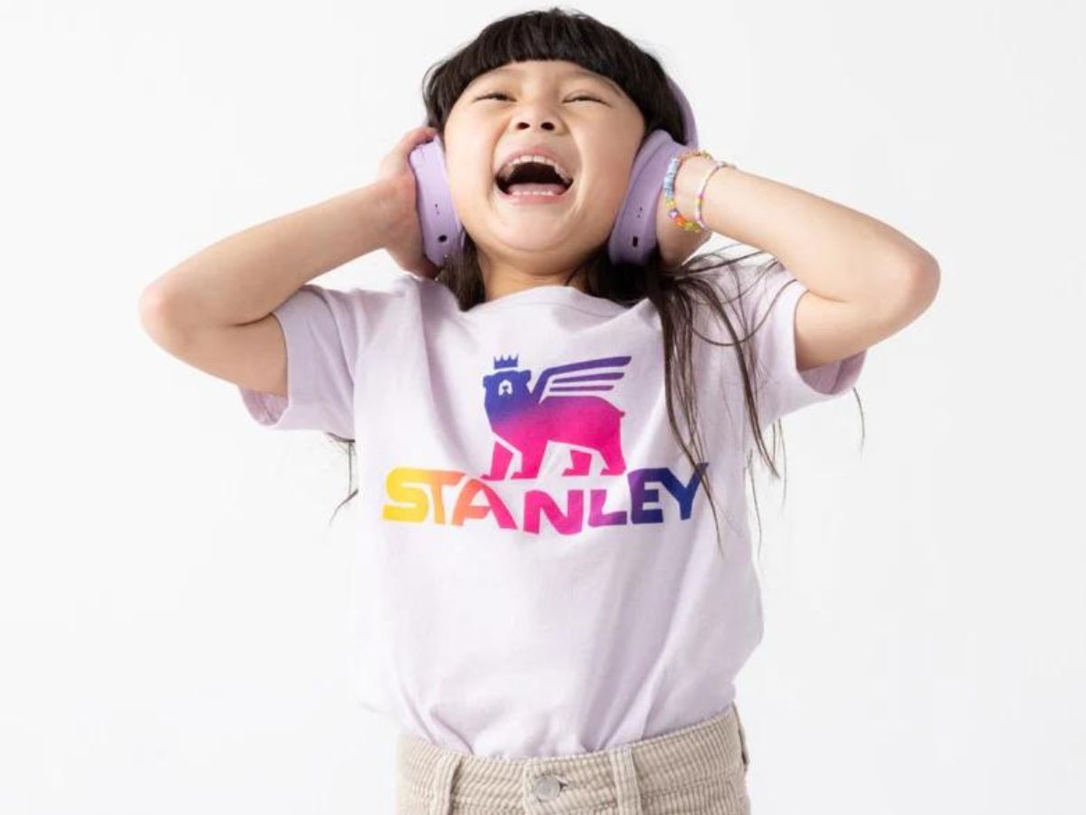 A little girl wearing a Stanley Tee