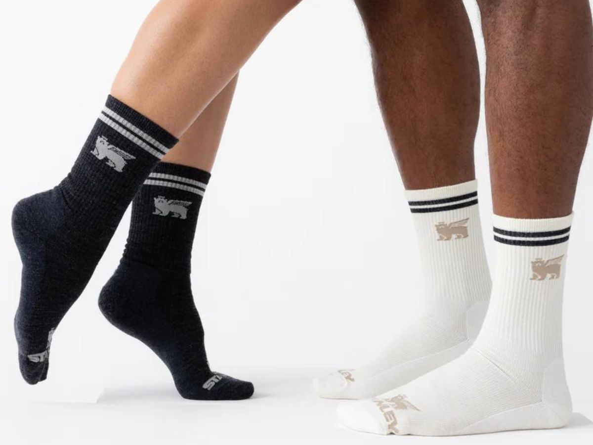A woman and a man wearing Stanley Apparel The Varsity Crew Socks