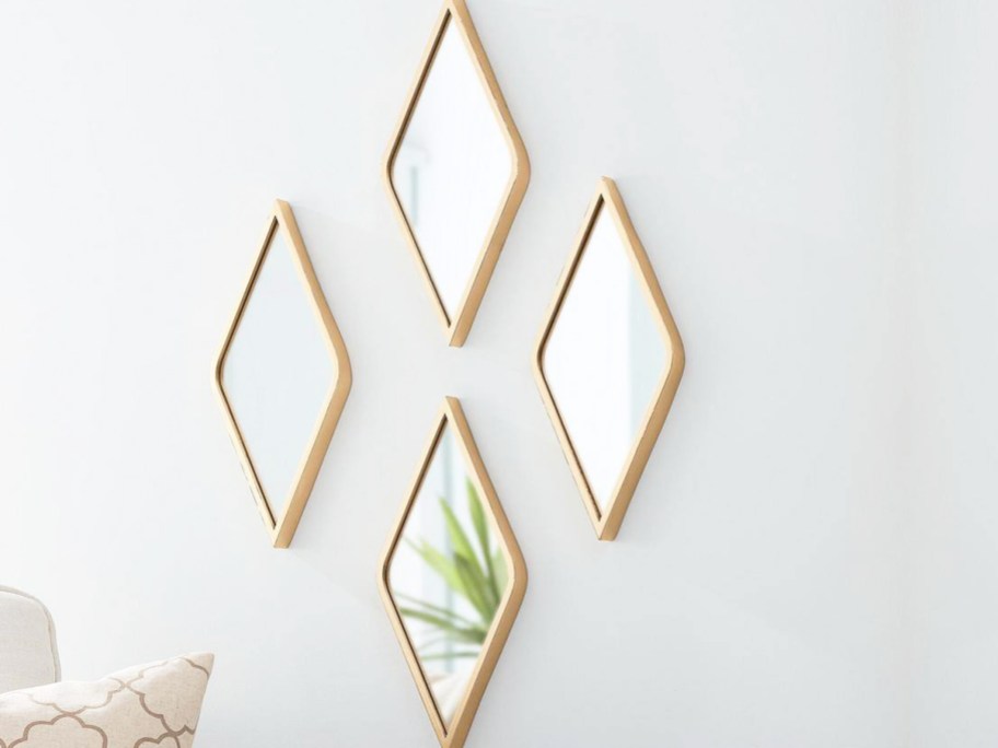 set of 4 diamond shaped mirrors on wall