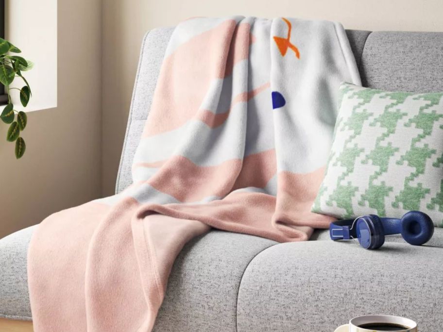 Room essentials pink bunny throw on a couch