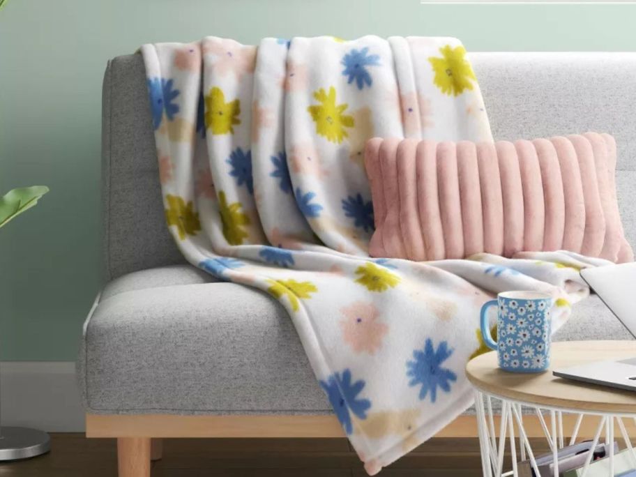 Room essentials floral bunny throw on a couch