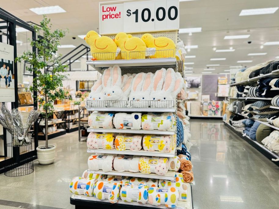 An endcap of Room Essentials Easter Throw Pillows and Blankets