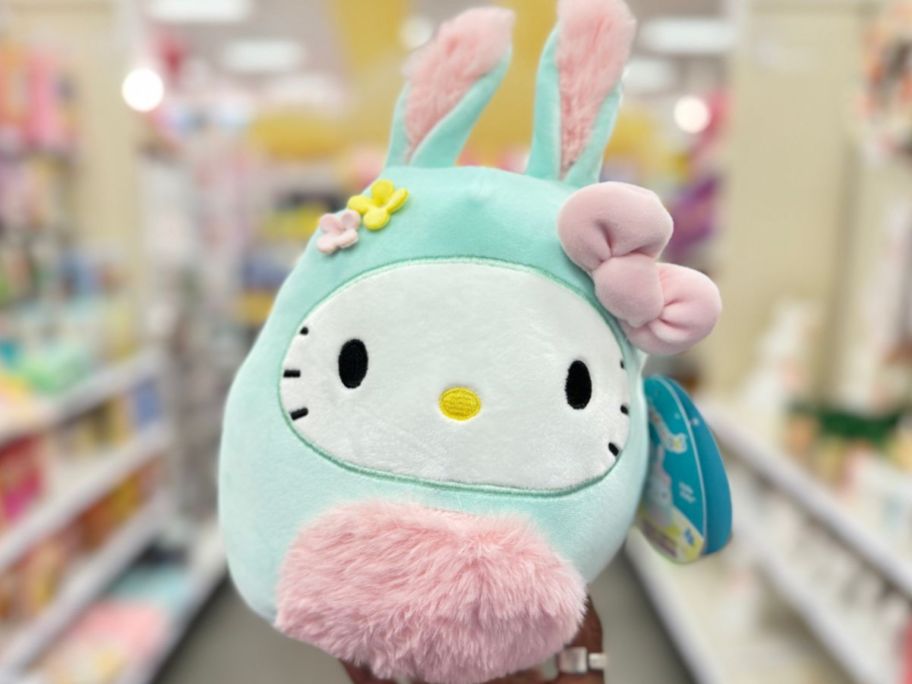 Hand holding up an Easter Bunny Hello Kitty Squishmallow