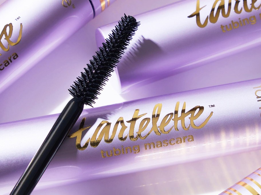 purple tubes of Tarte Tartelette Tubing Mascara with mascara wand on top of them