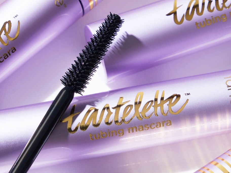 purple tubes of Tarte Tartelette Tubing Mascara with mascara wand on top of them
