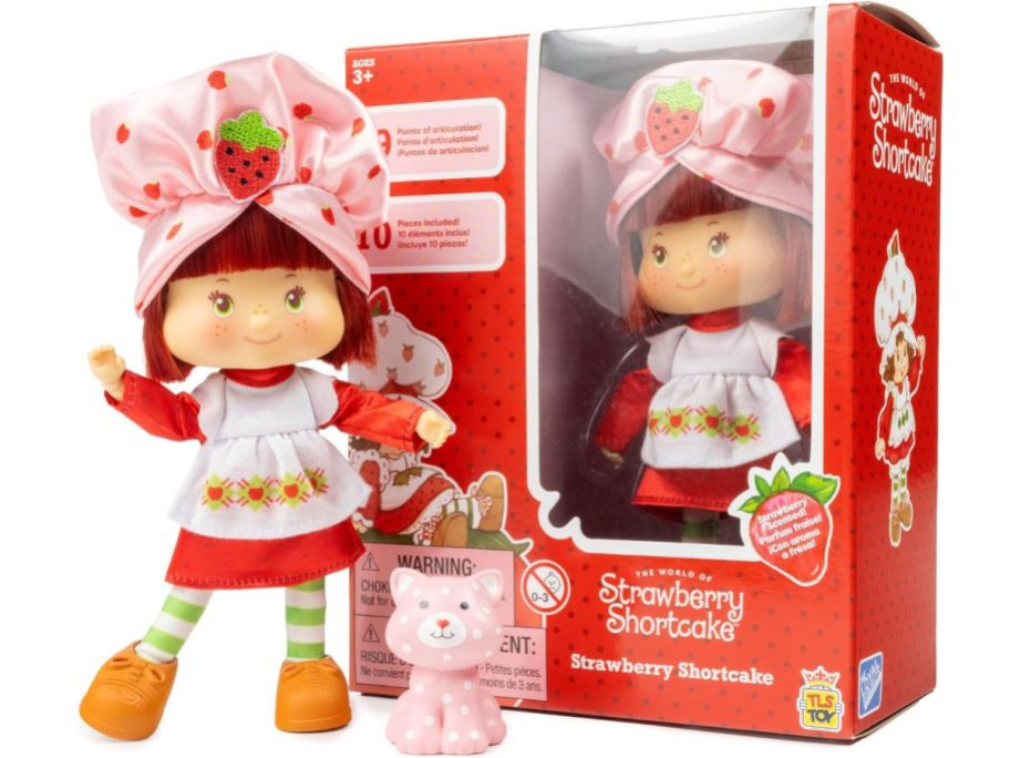 A Strawberry Shortcake 5.5-inch Fashion Doll with box and small cat toy. 