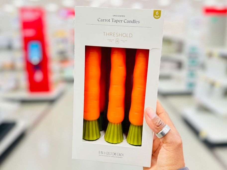 Threshold 6-Pack Carrot Taper Candle Set in hand in store