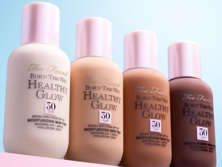 4 bottles of Too Faced Healthy Glow Foundation in different colors