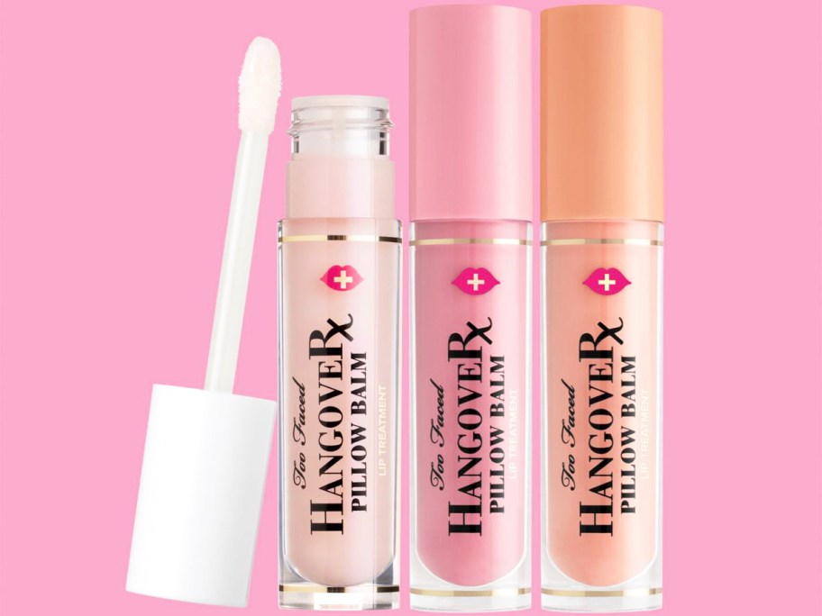 three pink and orange shades of Too Faced Pillow Balm Lip Balms