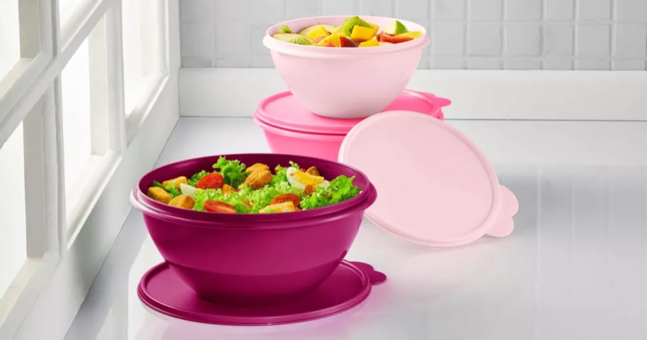 pink tupperware bowls with lids on kitchen counter