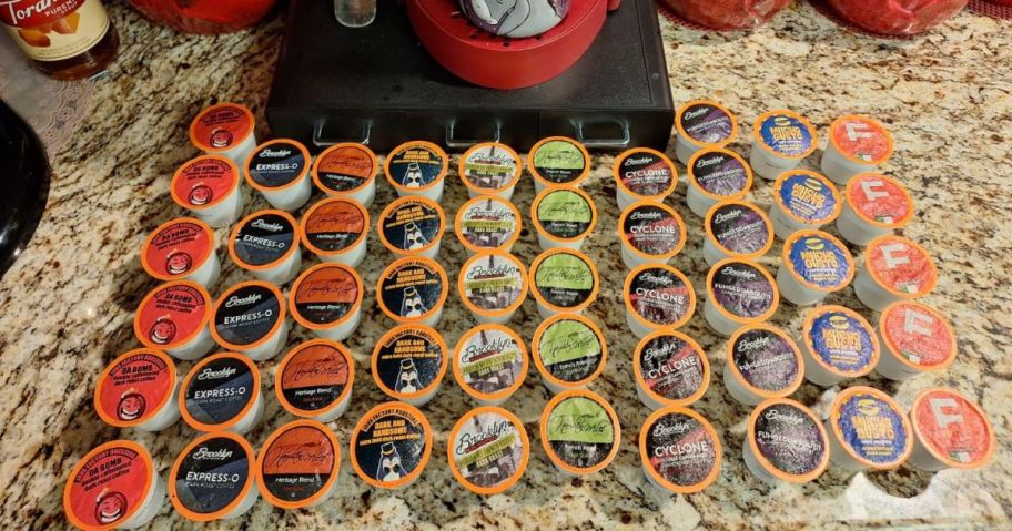 40 K-Cups on a counter in front of a Keurig 