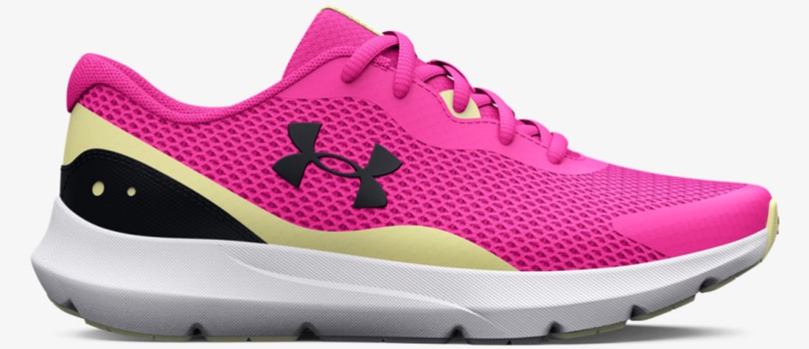 pink, yellow, and black under armour running shoe