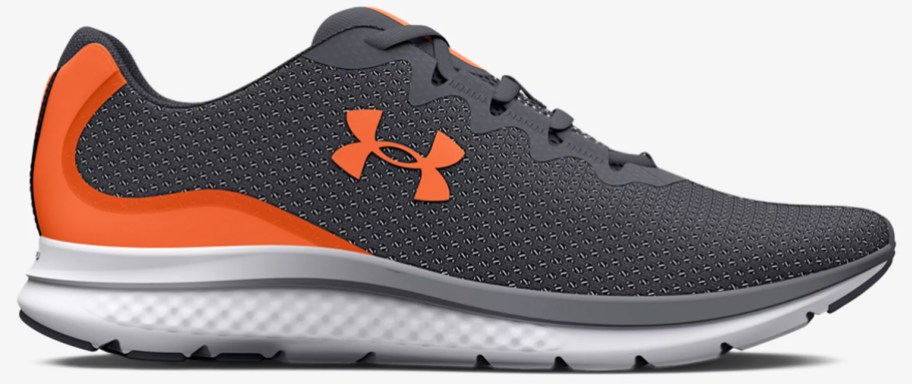 dark grey and orange under armour running shoe