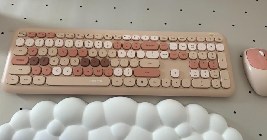 trendy wireless keyboard in neutrals and pinks with mouse on desk