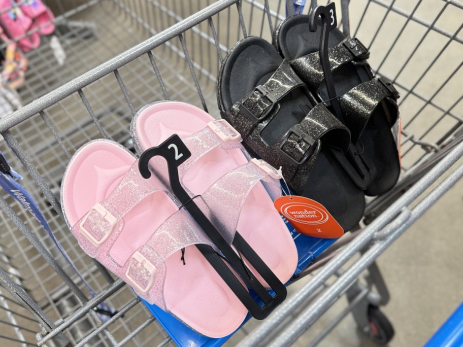 pairs of pink and black glittery sandals in shopping cart