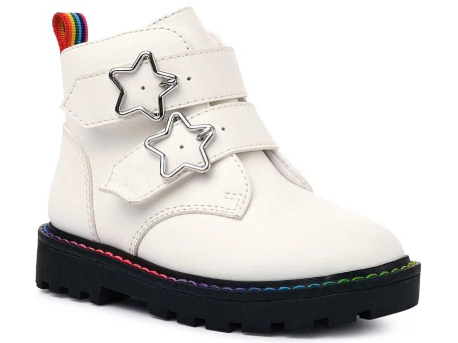white boot with star-shaped buckles