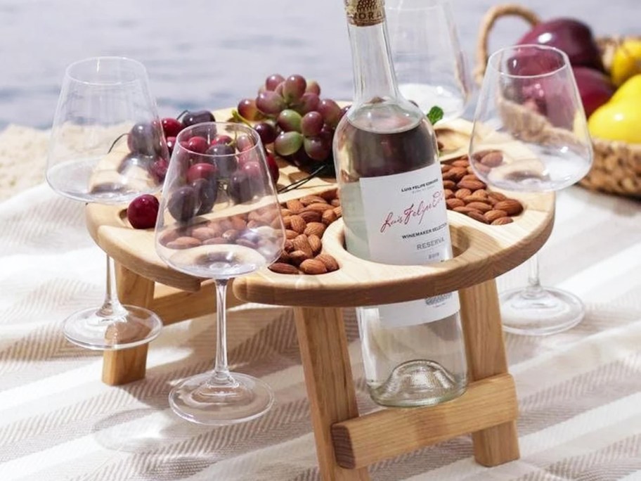 mini wood table with wine glass and bottle holders built in