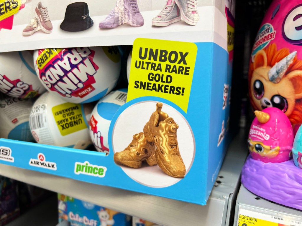 Ultra rare gold sneakers advertised on mini brands box display inside Walmart store