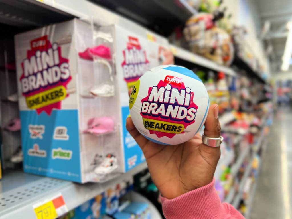Person holding Zulu mini brands sneaker ball inside Walmart store