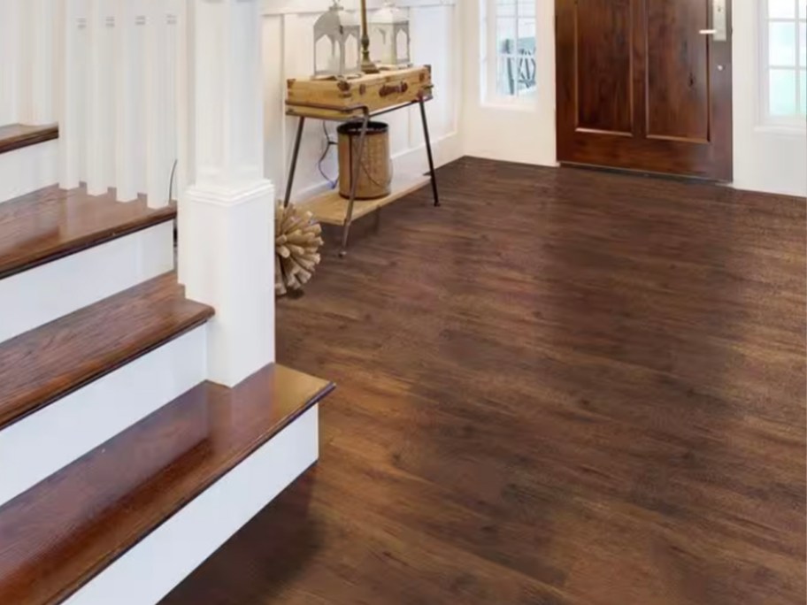 mahogany vinyl flooring in entryway with stairs