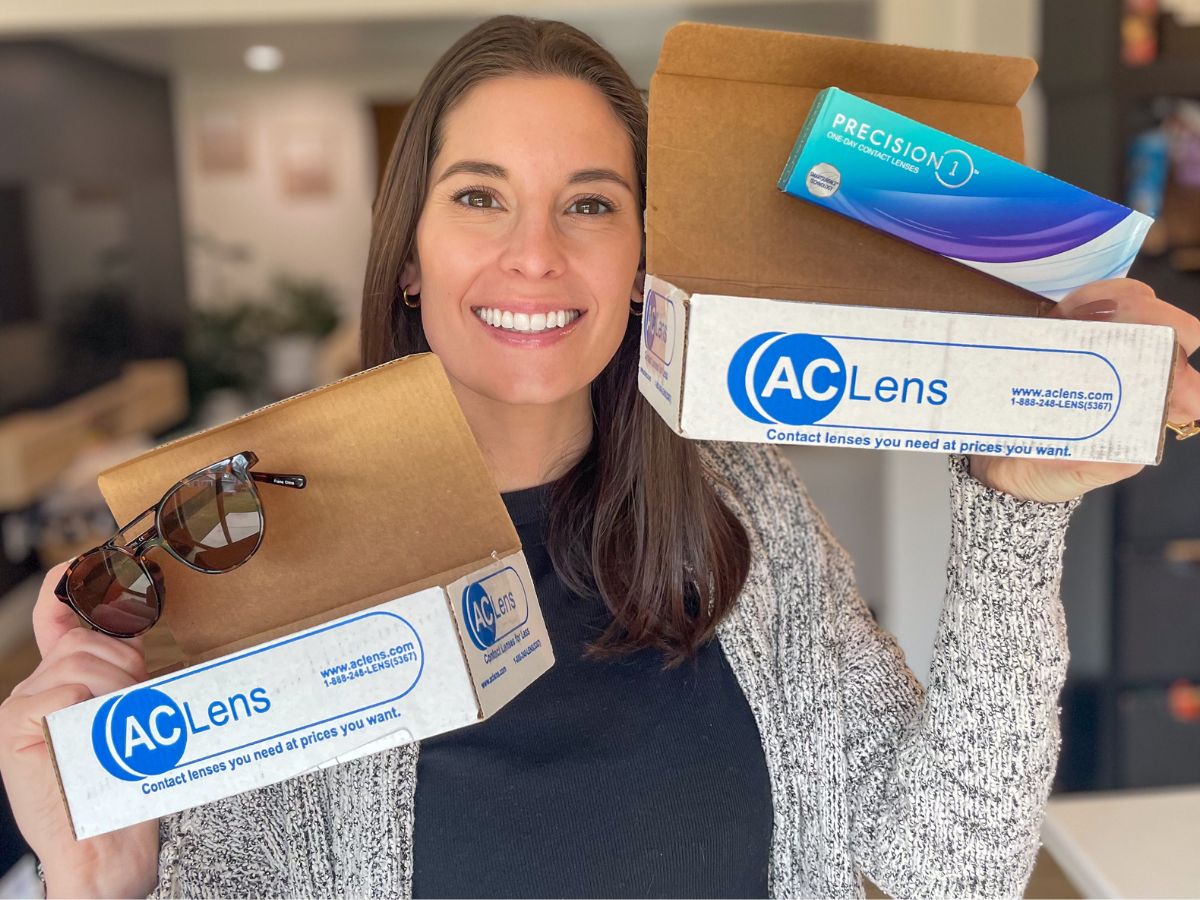 Emily holding boxes from ACLens.com one with sunglasses and the other with contacts