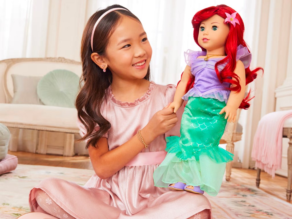 girl holding american girl ariel doll