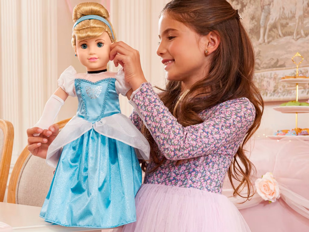girl playing with american girl cinderella doll