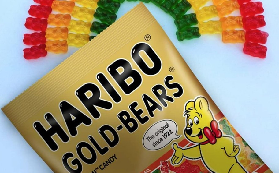 bag of haribo gold bears with rainbow in the back