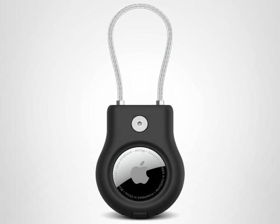 stock photo of apple airtag in black holder with wire cable