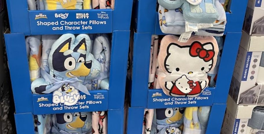 a bluey and a hello kitty pillow and throw sets