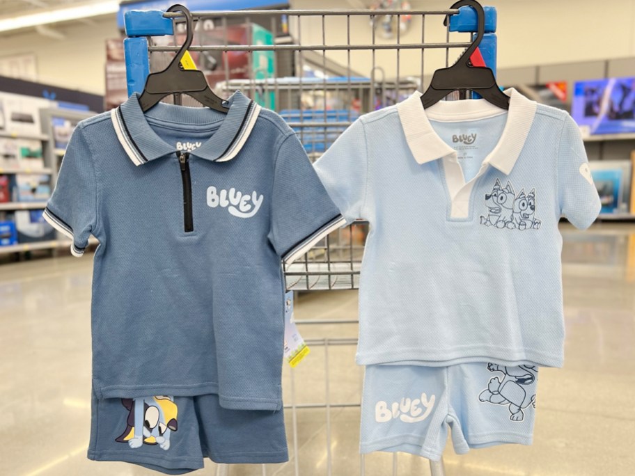 two bluey 2 piece outfits hanging on walmart shopping cart