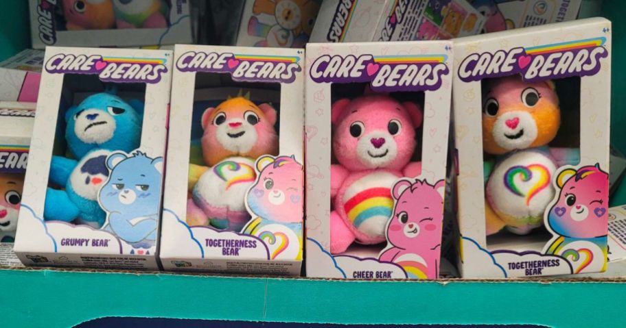 Care Bears Micro Plushes stacked beside each other with more behind them in a bin
