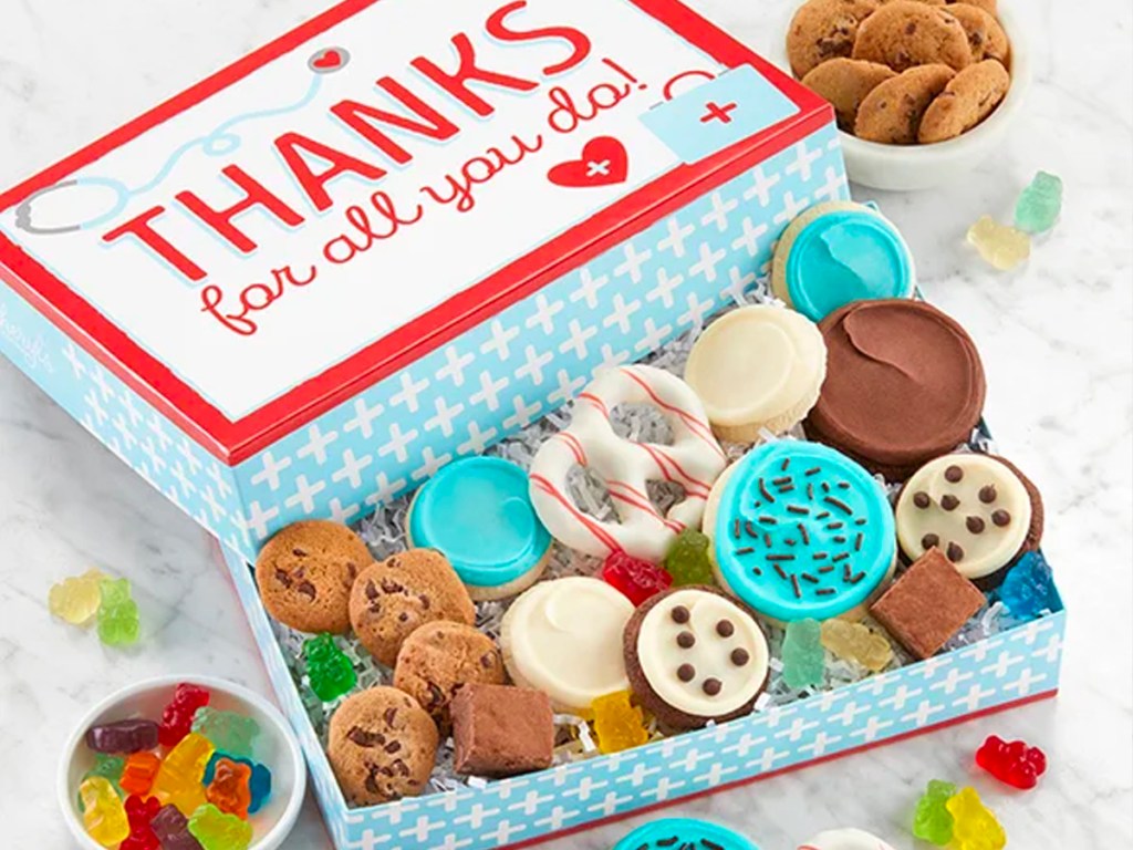 thanks healthcare cookie box on table full of cookies and candy